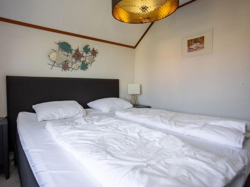 Mosselbank 83 Comfortable Holiday Residence Ouddorp Bagian luar foto