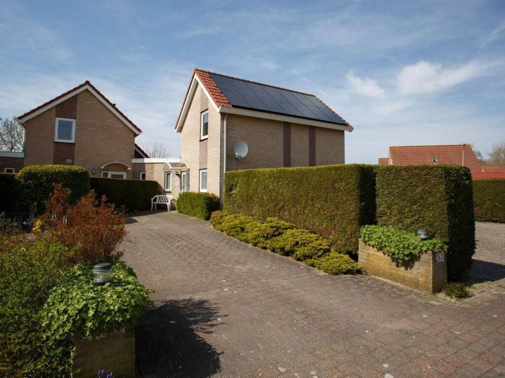 Mosselbank 83 Comfortable Holiday Residence Ouddorp Bagian luar foto